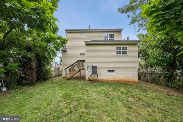 a view of a house with a yard and garage