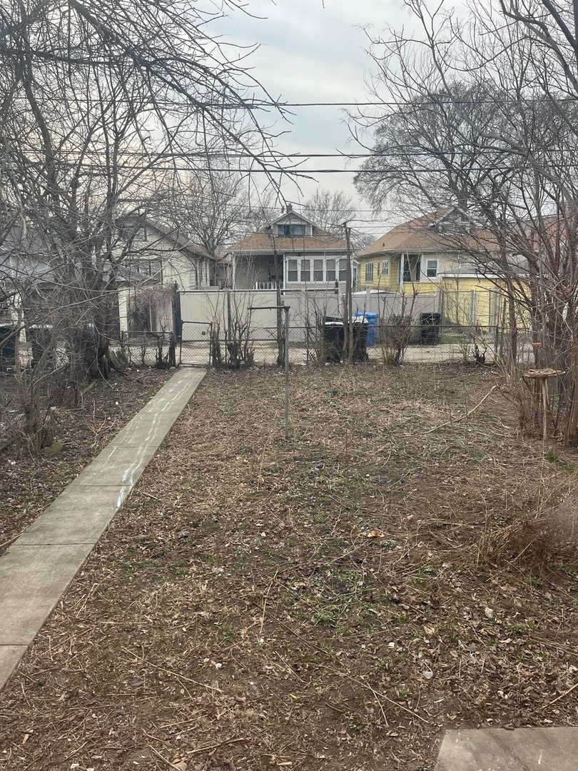 Undisclosed Address Chicago, IL 60628 - Photo 9 of 9 a view of a large house with a yard