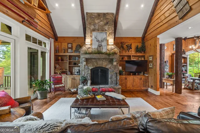 a dining room with furniture water view and outdoor space