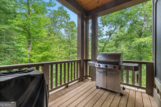 a kitchen with stainless steel appliances granite countertop a stove and a wooden cabinets