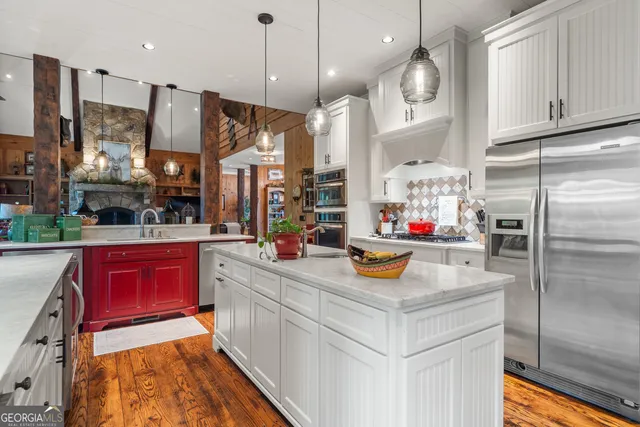 a living room with furniture a fireplace and a table