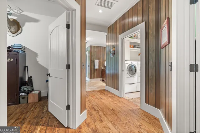 a bathroom with a granite countertop toilet a sink and a mirror