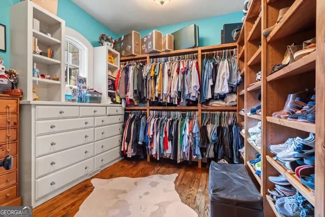 a view of an entryway with wooden floor and front door