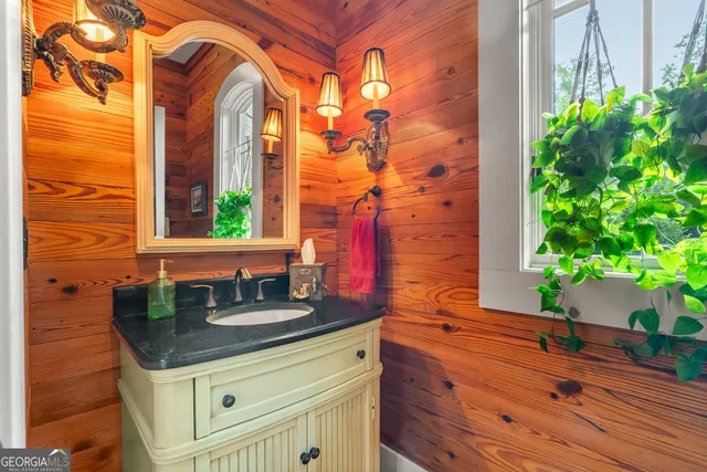 a bathroom with a toilet sink and shower