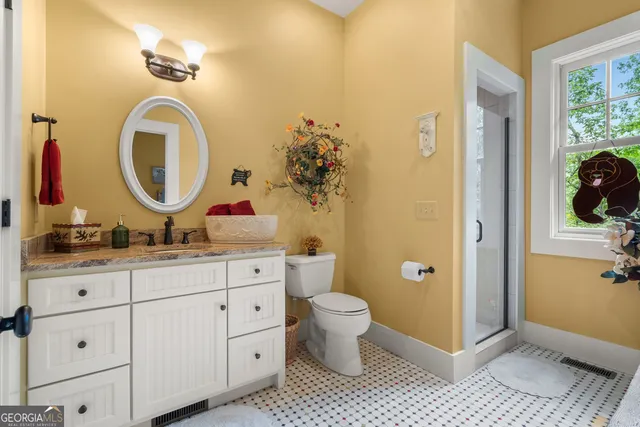 a backyard of a house with lots of green space and a fountain