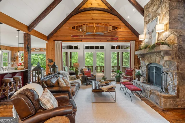 a living room with furniture fireplace and potted plants