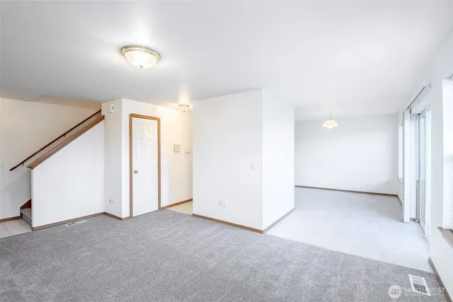 a view of a kitchen with a sink and a window