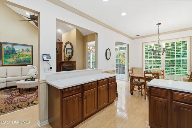 a large kitchen with kitchen island a large counter space appliances and furniture