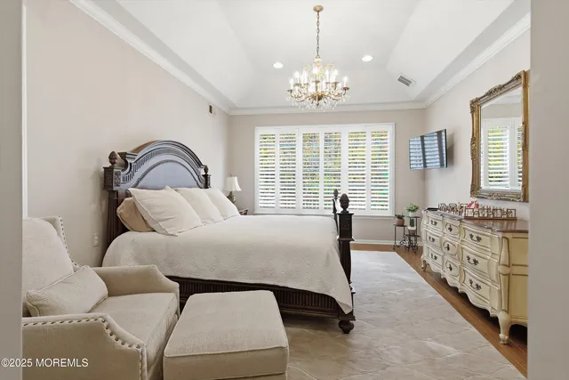 a bedroom with bed and window