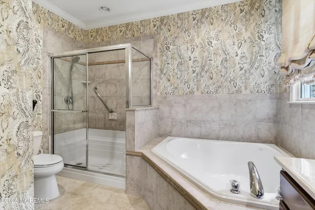 a bathroom with a bathtub and toilet