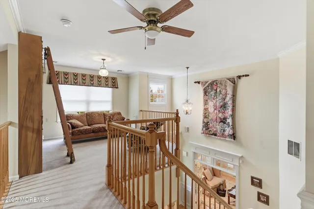a view of a livingroom with furniture and a window