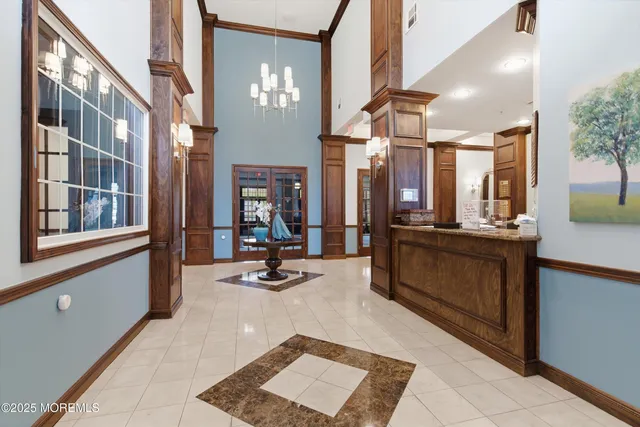 a view of a lobby with furniture and floor to ceiling windows