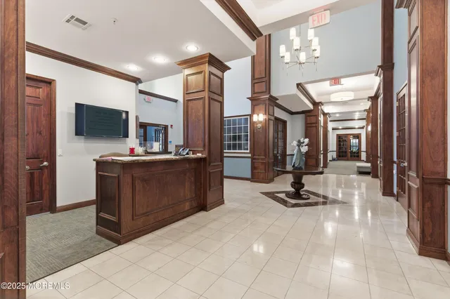 a view of a kitchen with cabinets and flat screen tv