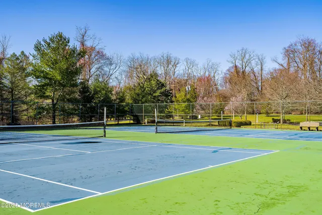 a view of swimming pool with an outdoor seating