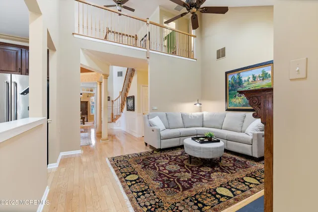 a living room with a couch and a rug