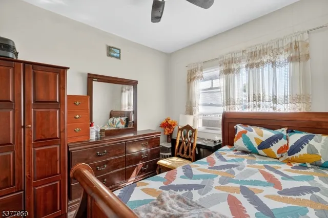 a bedroom with furniture and a window