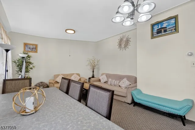 a bedroom with furniture and a wooden floor