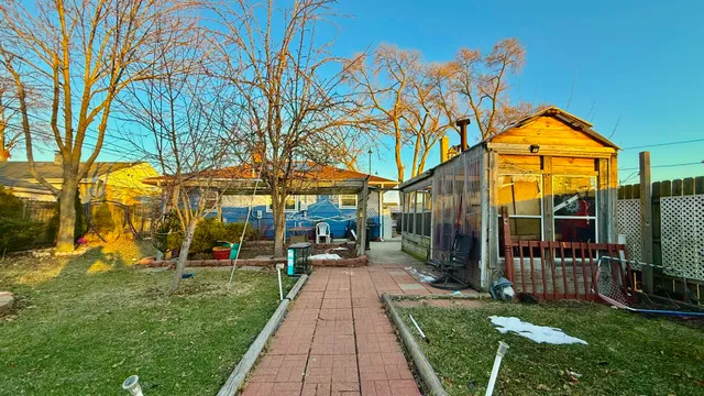 a view of a park with swings and slides