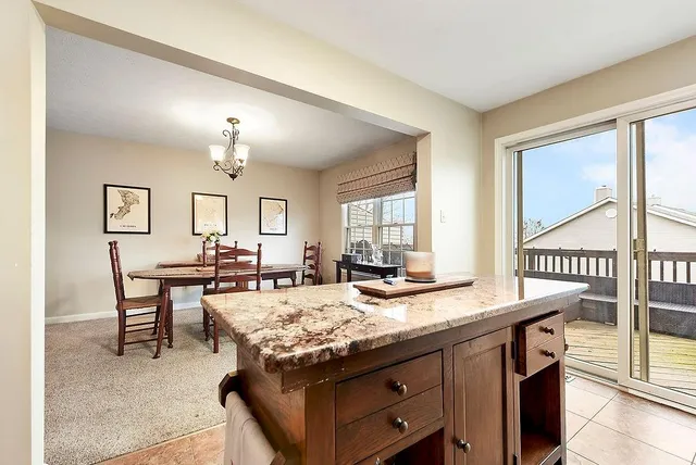 a view of a kitchen wooden cabinets and wooden floor