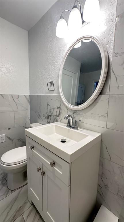 325 North Federal Highway, Unit 2 Lake Worth Beach, FL 33460 - Photo 5 of 10 a bathroom with a sink and mirror