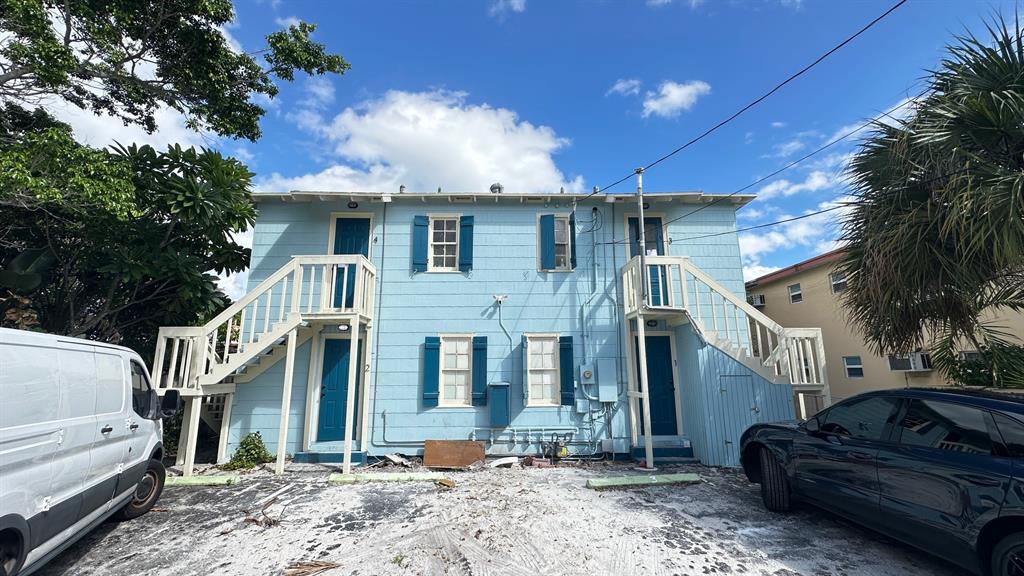 325 North Federal Highway, Unit 2 Lake Worth Beach, FL 33460 - Photo 10 of 10 a front view of a house with a yard