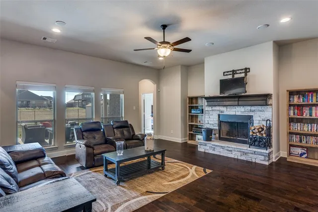 a living room with furniture and a fireplace