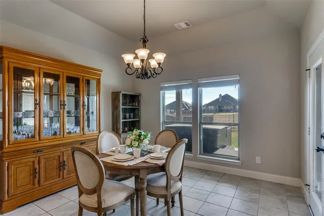 a dining room with furniture a livingroom and chandelier