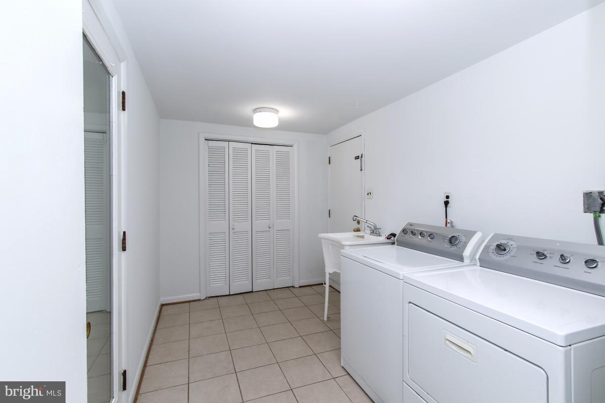 7617 Carteret Road Bethesda, MD 20817 - Photo 15 of 30 a view of storage and utility room with washer and dryer