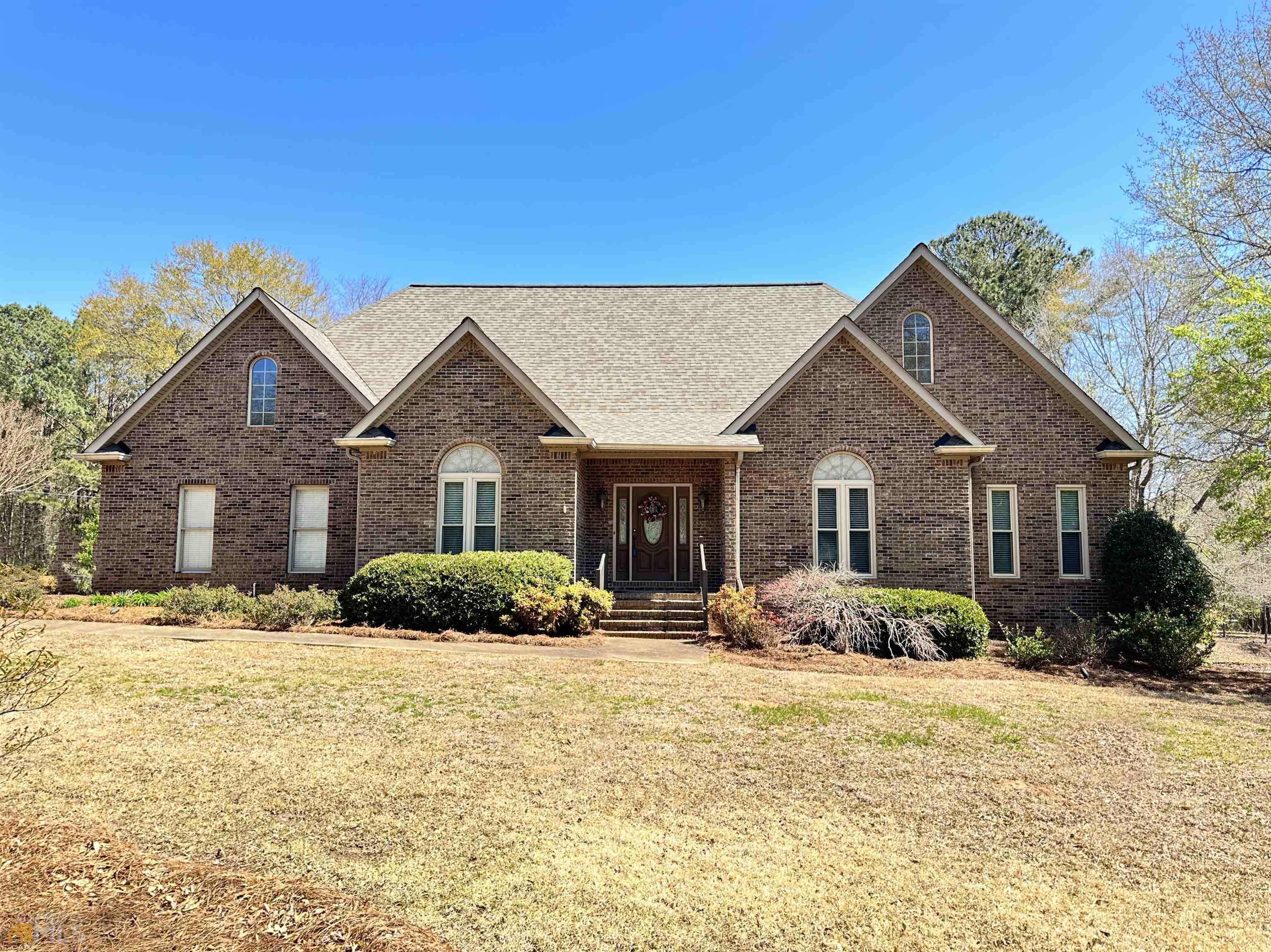 381 Hickory Ridge Road Jackson, GA 30233 - Photo 1 of 1 a front view of a house with a yard