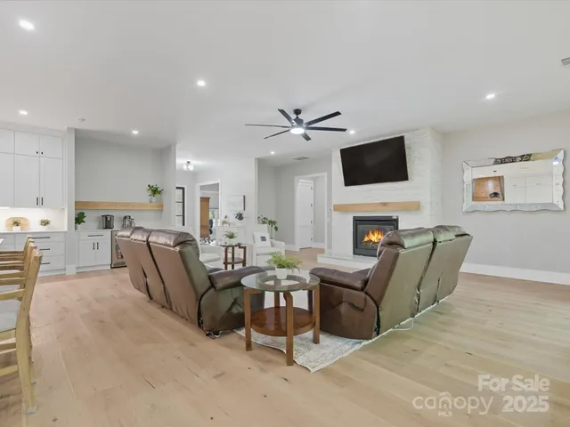a kitchen with stainless steel appliances kitchen island granite countertop a stove and a sink