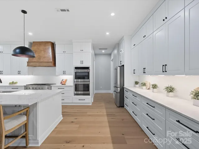 a spacious bathroom with a tub sink and mirror