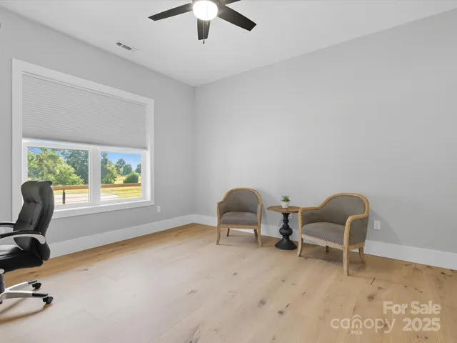 a bathroom with a toilet a sink and a mirror