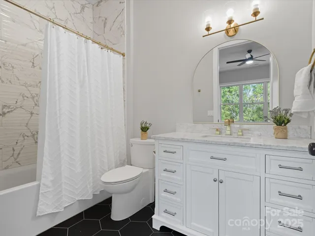 a outdoor living space with furniture and a potted plant