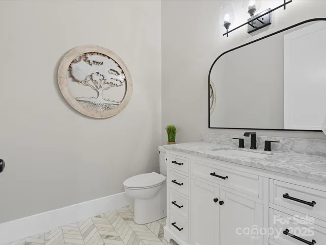 an aerial view of a house with a yard swimming pool and outdoor seating