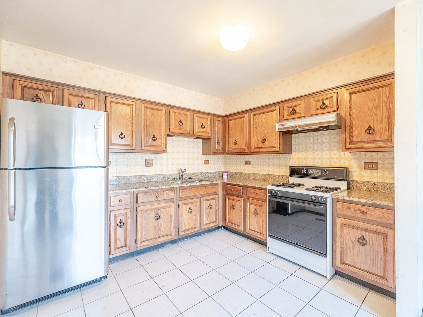 204 Mill Stream Drive Bolingbrook, IL 60440 - Photo 4 of 9 a kitchen with granite countertop cabinets stainless steel appliances and a sink