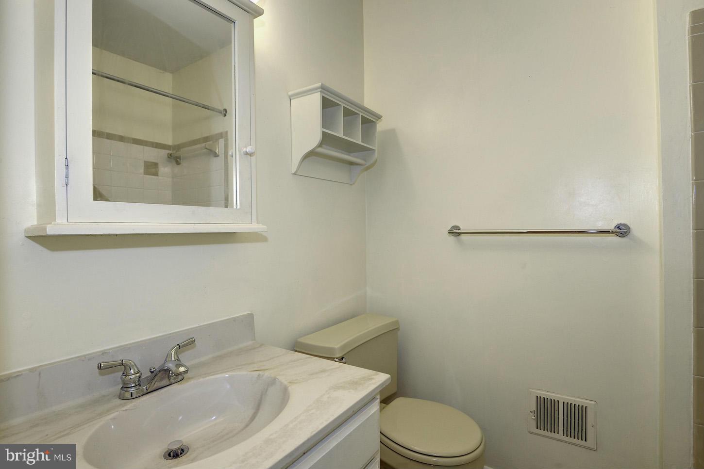 16110 Accolawn Road Accokeek, MD 20607 - Photo 14 of 20 a bathroom with a sink and a toilet