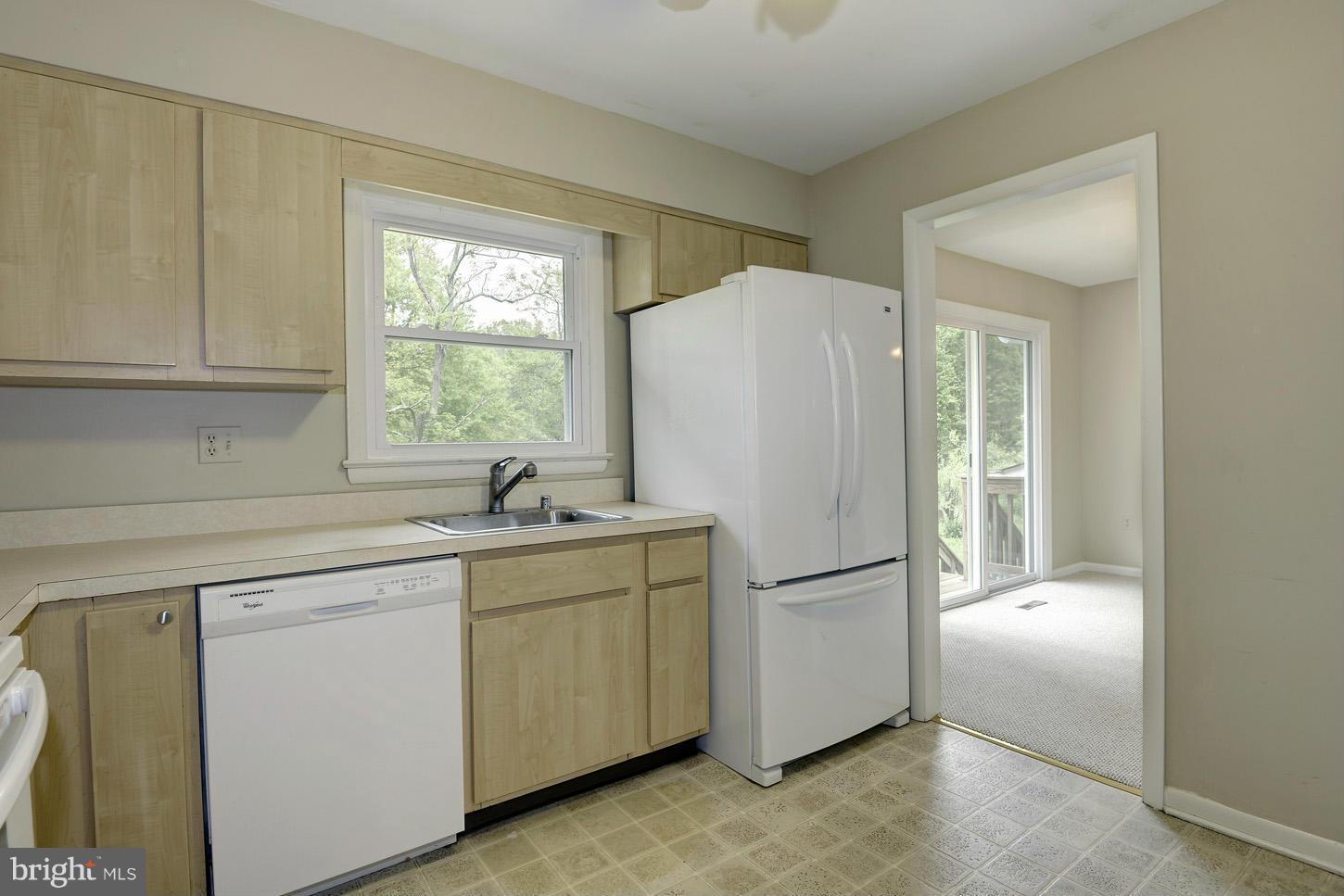 16110 Accolawn Road Accokeek, MD 20607 - Photo 9 of 20 a white refrigerator freezer sitting in a kitchen
