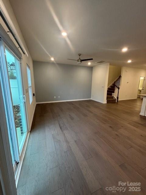 118 Quinn Road Matthews, NC 28104 - Photo 18 of 29 an empty room with wooden floor and windows