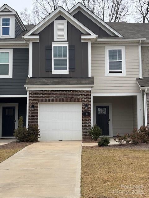 118 Quinn Road Matthews, NC 28104 - Photo 2 of 29 a front view of a house with a yard and garage