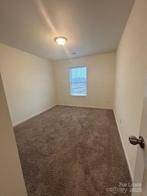 118 Quinn Road Matthews, NC 28104 - Photo 5 of 29 an empty room with a empty space and windows