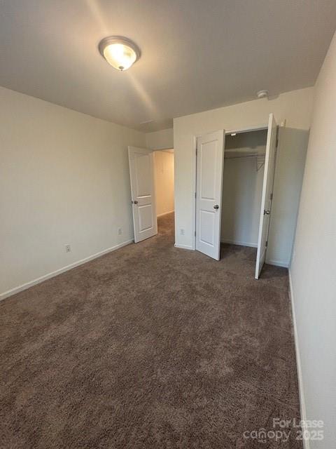 118 Quinn Road Matthews, NC 28104 - Photo 6 of 29 an empty room with closet and windows