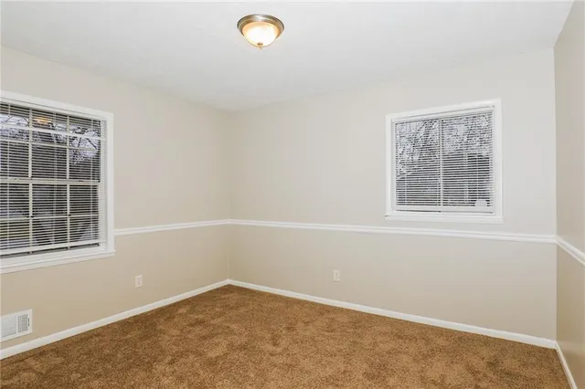 a view of an empty room and window