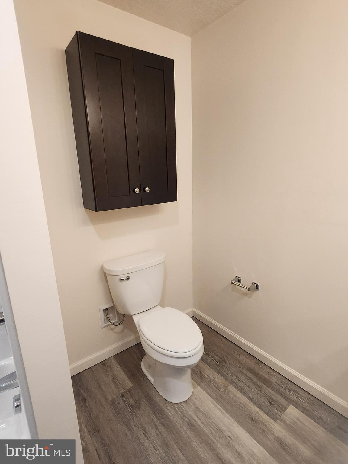 65 Woods Edge Road, Unit 18 Fort Ashby, WV 26719 - Photo 9 of 12 a bathroom with a toilet and a mirror