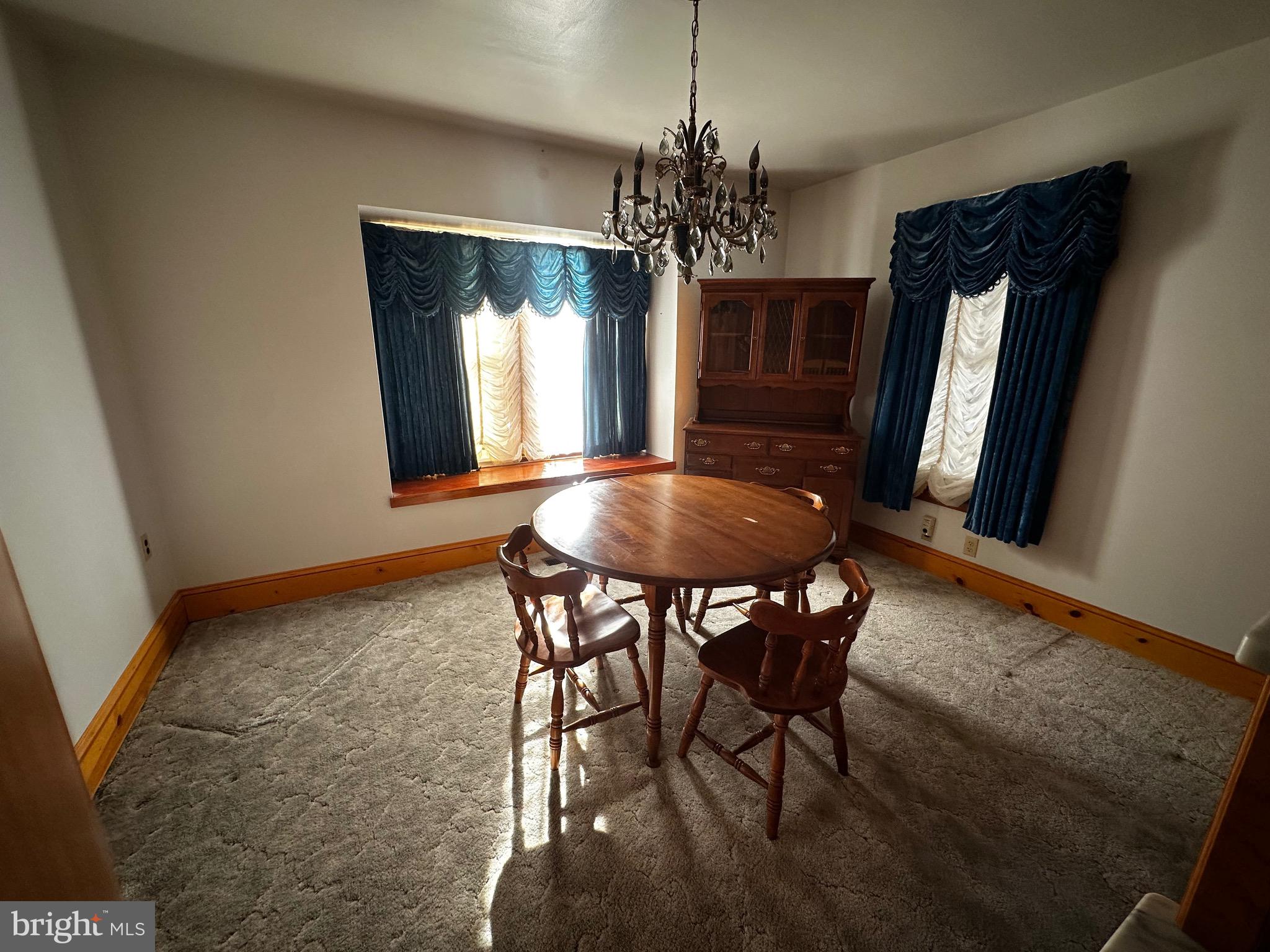 3500 Paw Paw Road Paw Paw, WV 25434 - Photo 26 of 48 a view of a dining room with furniture and window