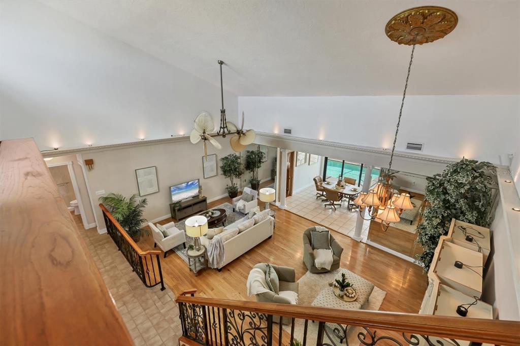 133 Inlets Boulevard, Unit 133 Nokomis, FL 34275 - Photo 26 of 63 a living room with furniture and a chandelier