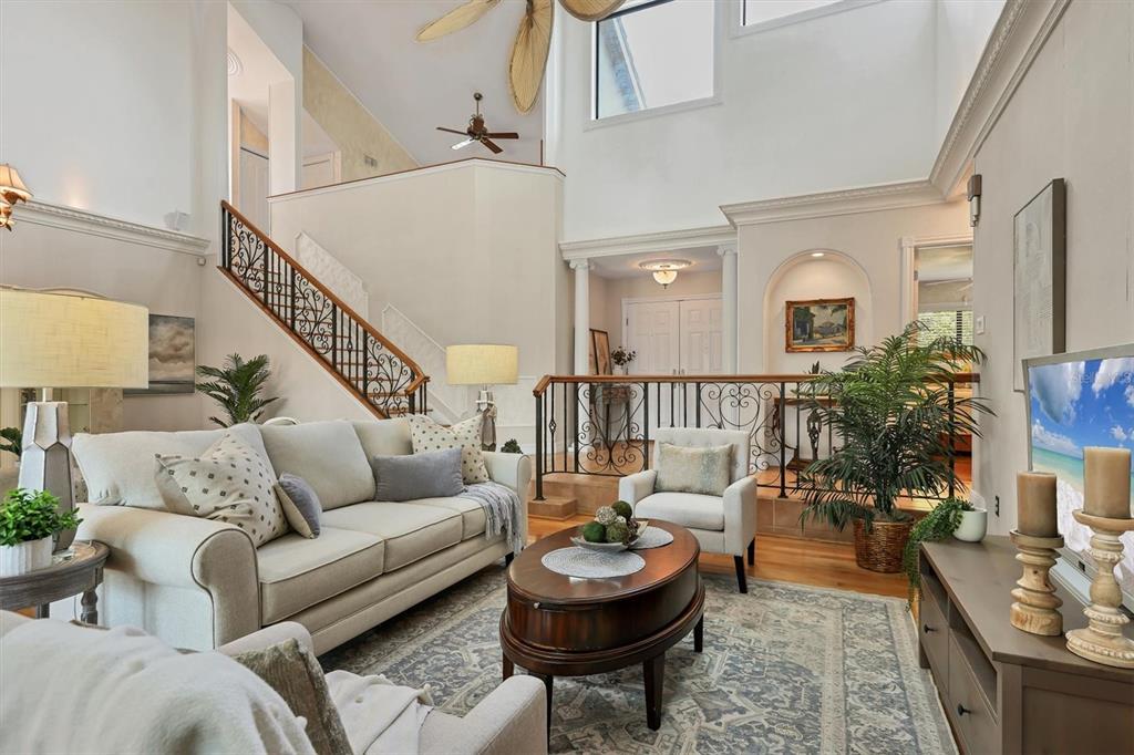 133 Inlets Boulevard, Unit 133 Nokomis, FL 34275 - Photo 6 of 63 a living room with furniture and a potted plant