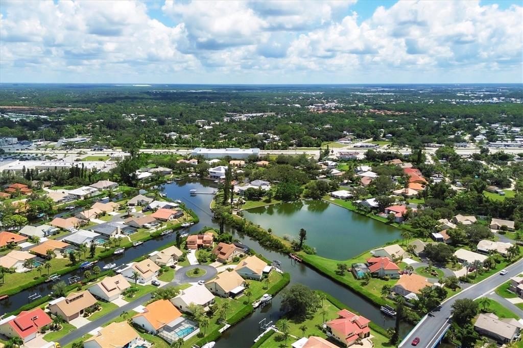 133 Inlets Boulevard, Unit 133 Nokomis, FL 34275 - Photo 61 of 63 an aerial view of city and lake