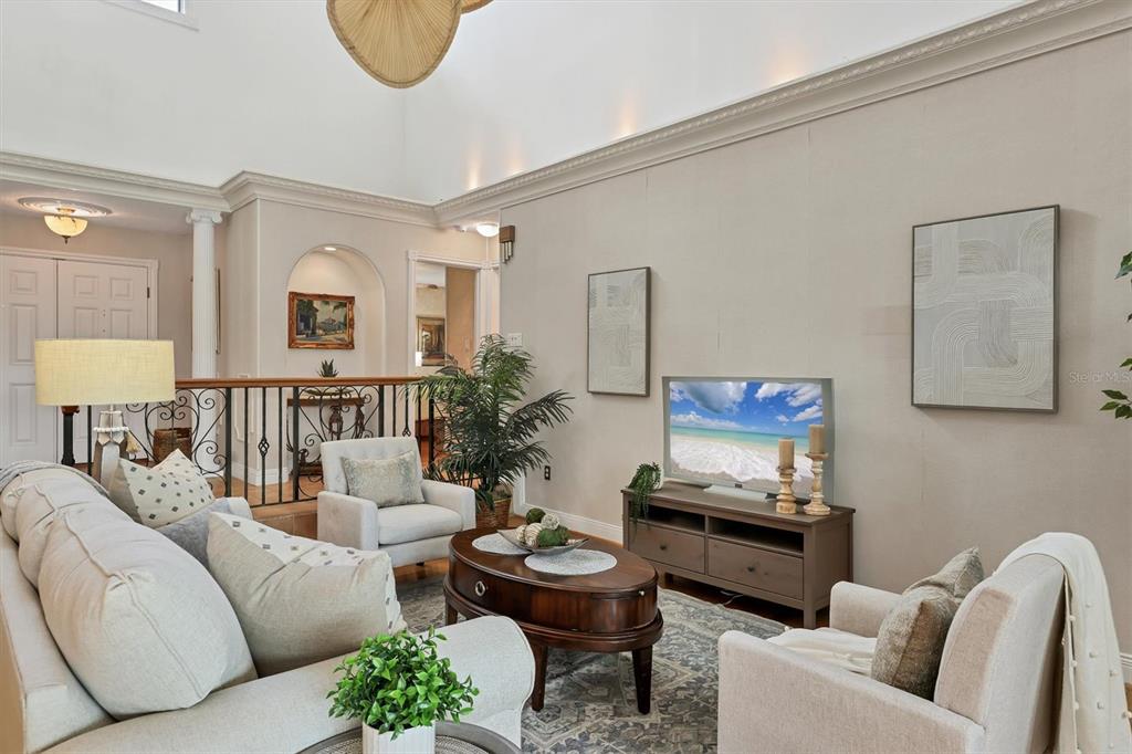 133 Inlets Boulevard, Unit 133 Nokomis, FL 34275 - Photo 8 of 63 a living room with furniture and a table