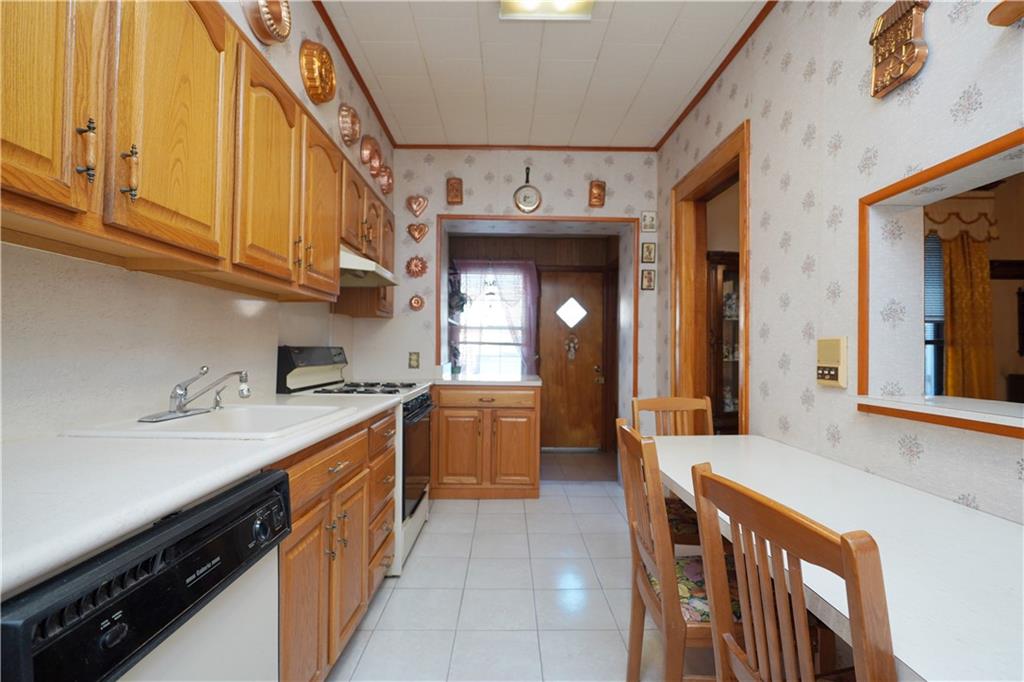 649 Bay Ridge Parkway Brooklyn, NY 11209 - Photo 13 of 29 a kitchen with stainless steel appliances granite countertop a sink and cabinets