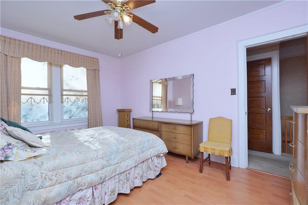649 Bay Ridge Parkway Brooklyn, NY 11209 - Photo 18 of 29 a bedroom with a bed chair and window